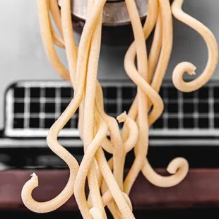 a close up of a pasta being cooked