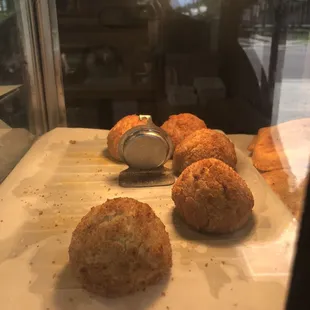 a tray of breaded pastries