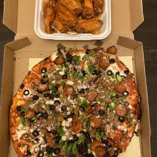 Large combo pizza and a dozen of hot wings