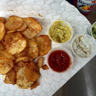 Thinly sliced crispy potato chips, seasoning has a kick to it &amp; they were not oily!