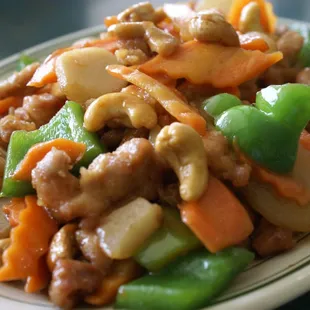 Chicken with Cashew Nuts (C1) comes with Rice. Also available in Beef, Shrimp, or Tofu.