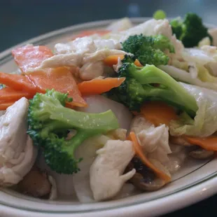 Chicken with Broccoli (C7) comes with rice. White Sauce Pictured. Other Sauces also available.