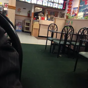 a restaurant with tables and chairs