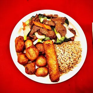 a plate of food and chopsticks