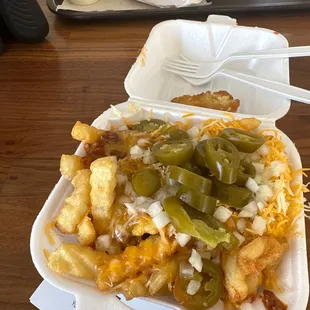 Small chili cheese fries with jalapeños and onion