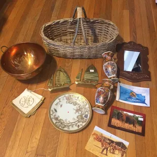 $8 copper bowl, $3 basket, $6 ship bookends, $5 mirror, $5 2 vases, $2 plate, $4 "N" napkins, $1.50 3 postcards. Not bad at all