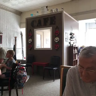 a man and two children sitting at a table