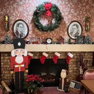 a fireplace decorated for christmas
