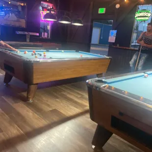 two pool tables in a pub