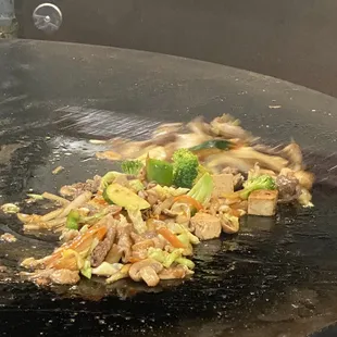 a wok full of food