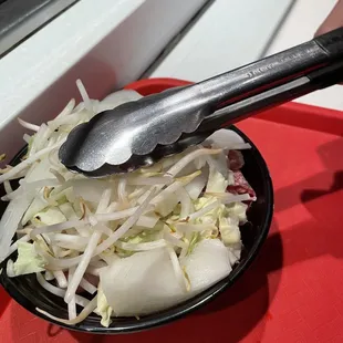 a bowl of food with a spoon in it