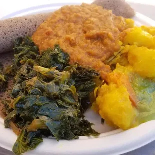 vegetarian plate- injera bread, kale gomen, lentils and potatoes