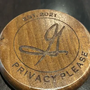 Medallion on the table that you flip one way or the other to let your server know you need assistance.