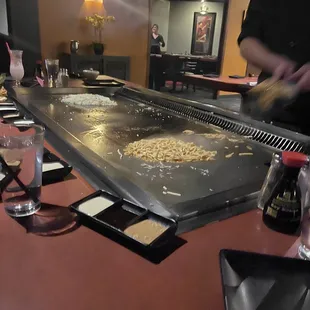 Chef preparing noodles and fried rice