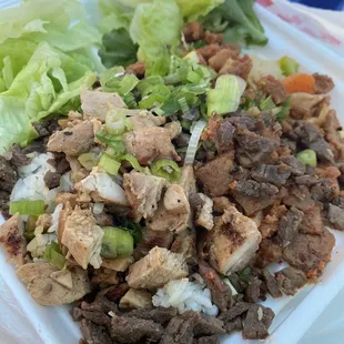 Plate of rice spicy pork and beef. (Ignore the chicken on top....I took it off the other plate I had )