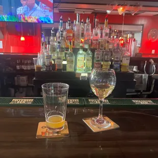 two glasses of wine on the bar