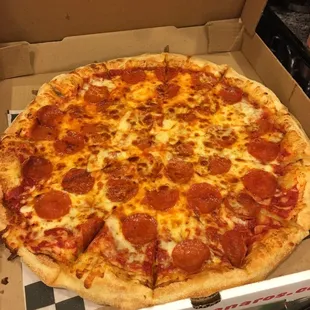 The delivery pizza is solid. The free breadsticks always sell us. XL Pepperoni