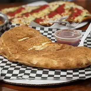 Calzone. With some mozz and some ricotta - but the kind you'll find in a cannoli. You want that cheese-pull? Get it here.