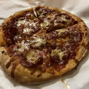 The pizza was not burnt just not a good photo