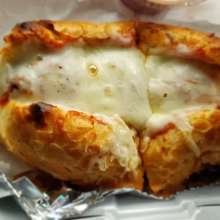 The meatball sandwich with requested garlic bread and cheese.