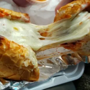 Meatball sandwich on garlic bread.