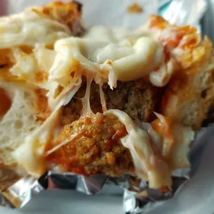 The meatball on garlic bread with cheese