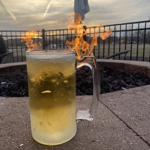 a glass of beer on a patio