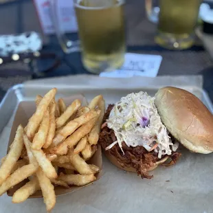 a pulled pork sandwich and fries