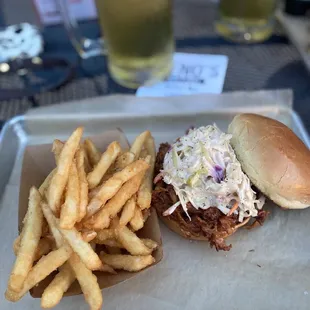 a pulled pork sandwich and fries