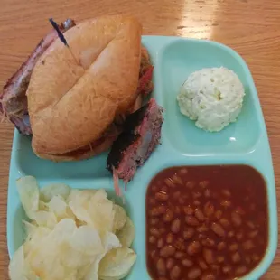 a sandwich, beans, and potato chips
