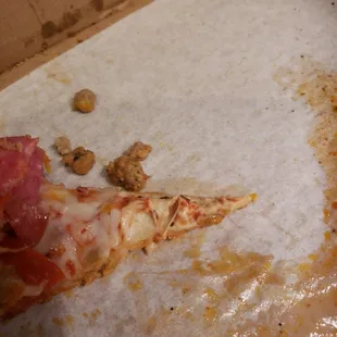 a half eaten pizza in a box