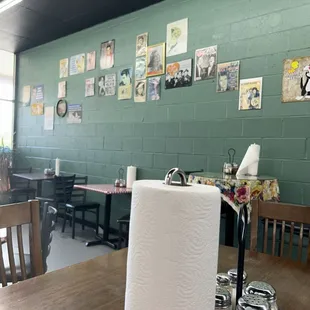 Wall with photos and kitschy signs