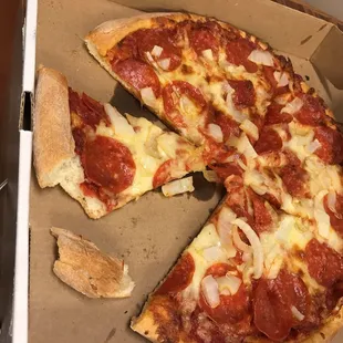 a half eaten pizza in a box