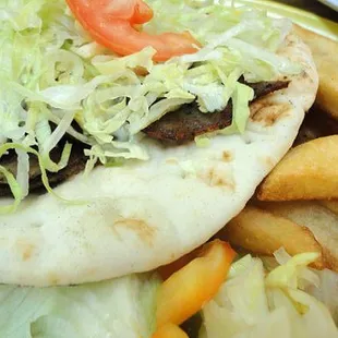 a plate of french fries and salad