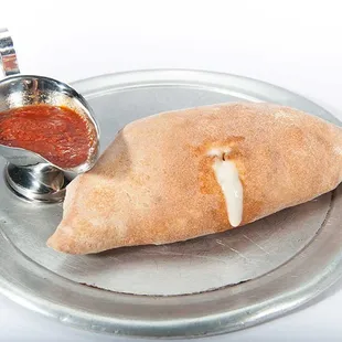 Plain stromboli with mozzarella and homemade pizza sauce from Genova's To Go.