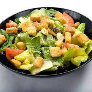 A delicious Caesar salad with croutons and tomatoes. The perfect meal from Genova&apos;s To Go.