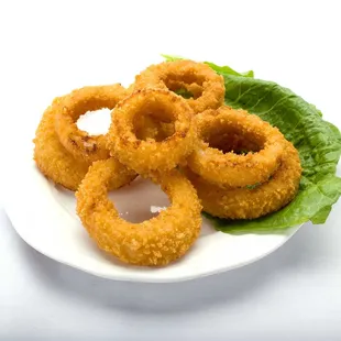 Fried onion rings with lettuce on top, served at Genova&apos;s To Go. A delicious and crispy appetizer!