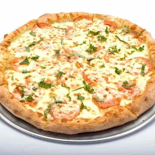 Tomato basil pizza from Genova&apos;s To Go, topped with cheese and tomatoes on a white surface.