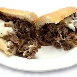 A plate featuring a delectable half of a cheesesteak sub from Genova&apos;s To Go. Pure sandwich perfection!