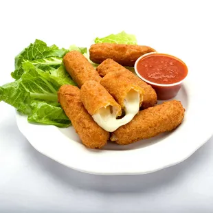 Plate of Genova&apos;s To Go mozzarella sticks with a savory sauce, perfect for a delicious snack.
