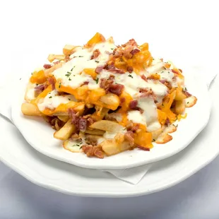 Plate of Cheecho Fries: Crispy golden french fries covered in melted cheese and crispy bacon bits from Genova&apos;s To Go.