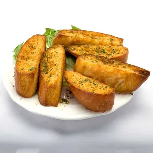 Plate of garlic bread with cheese and herbs from Genova&apos;s To Go. Delicious combination of flavors.