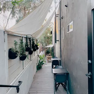 a patio with tables and chairs