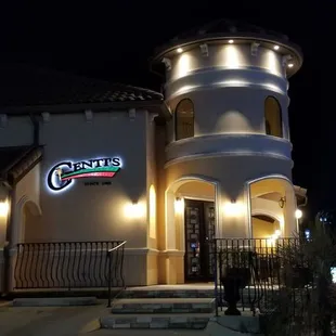 the front of the restaurant at night