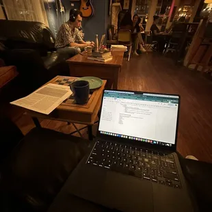 a laptop on a coffee table