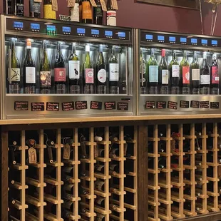 a row of wine bottles on display