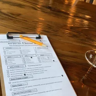 a glass of wine and a menu