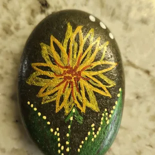 A hand painted stone by a 90 year old woman made this really special.