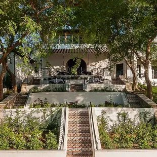 You can walk the hill and the steps, but we suggest the complimentary valet parking at the top of the hill!
