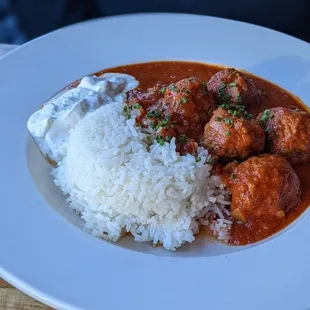 a plate of meatballs and rice